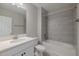 Bathroom featuring a shower over bath combination, tile flooring and a white vanity sink at 5329 Senza Trl, Palmetto, FL 34221