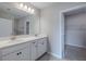 Bathroom features double sinks, quartz countertops, and walk-in closet at 5329 Senza Trl, Palmetto, FL 34221
