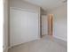 Bright bedroom boasts carpeted floors, a window, and a closet with sliding doors at 5329 Senza Trl, Palmetto, FL 34221