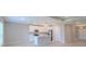 Open concept kitchen with stainless appliances, kitchen island with breakfast bar, and pendant lights at 5329 Senza Trl, Palmetto, FL 34221