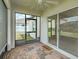 A screened-in lanai with brick flooring, a ceiling fan, and a view to the backyard at 5329 Senza Trl, Palmetto, FL 34221