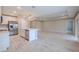 Spacious open-concept living area with modern kitchen featuring an island and stainless appliances at 5329 Senza Trl, Palmetto, FL 34221