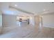 Spacious open concept living room and kitchen with hardwood floors and ample natural light at 5329 Senza Trl, Palmetto, FL 34221