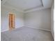 Spacious main bedroom boasts tray ceilings and plush carpeting at 5329 Senza Trl, Palmetto, FL 34221