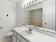 Neutral bathroom featuring a tub and shower combination, updated lighting, and a white vanity at 5785 Gardens Dr, Sarasota, FL 34243