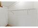 Storage closet showcasing painted concrete blocks and shelving at 5785 Gardens Dr, Sarasota, FL 34243