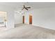 Open-concept living area featuring neutral colors and multiple closets at 5785 Gardens Dr, Sarasota, FL 34243