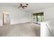 Bright living room with sliding glass doors leading to a screened-in patio at 5785 Gardens Dr, Sarasota, FL 34243