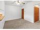 Cozy living room with neutral carpet and two large closets at 5785 Gardens Dr, Sarasota, FL 34243