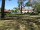 Scenic view of the community pool surrounded by lush landscaping at 5785 Gardens Dr, Sarasota, FL 34243