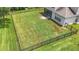 An aerial view of a large fenced backyard with ample green space at 5830 100Th E Ave, Parrish, FL 34219