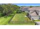 Spacious fenced backyard with lush greenery and landscaping at 5830 100Th E Ave, Parrish, FL 34219