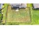 Aerial view of fenced backyard and patio area, perfect for outdoor living at 5830 100Th E Ave, Parrish, FL 34219