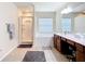 Bright bathroom with a walk-in shower, soaking tub, dual sinks and vanity space at 5830 100Th E Ave, Parrish, FL 34219