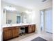This bathroom has dual sinks and a vanity with a mirror over the sinks at 5830 100Th E Ave, Parrish, FL 34219
