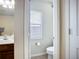 This bathroom has a single toilet with a door to separate it from the rest of the bathroom at 5830 100Th E Ave, Parrish, FL 34219