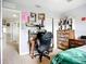 Comfortable bedroom with a desk, chair, and dresser featuring unique decorations at 5830 100Th E Ave, Parrish, FL 34219