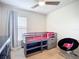 This bedroom has a bed frame that can be used as storage and drawers at 5830 100Th E Ave, Parrish, FL 34219