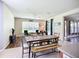 Eat-in kitchen with dining table and chairs, view to living space with natural light at 5830 100Th E Ave, Parrish, FL 34219