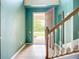 Bright foyer with tile flooring, staircase, and view of the front door at 5830 100Th E Ave, Parrish, FL 34219