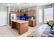 Large kitchen with stainless steel appliances, island, and tile flooring at 5830 100Th E Ave, Parrish, FL 34219