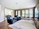 Cozy living room with hardwood floors, comfortable seating, and natural light at 5830 100Th E Ave, Parrish, FL 34219