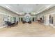 A spacious lounge area features stone accents, comfortable seating, and a well-lit bar, perfect for social gatherings at 5830 100Th E Ave, Parrish, FL 34219