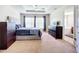 Spacious main bedroom with a tray ceiling and a view of the luxurious ensuite bathroom at 5830 100Th E Ave, Parrish, FL 34219