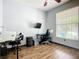 Functional home office space with desk setup and ample natural light from the window at 5830 100Th E Ave, Parrish, FL 34219