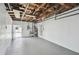 Unfinished basement with painted walls, exposed wood, and a door to the yard at 5934 51St N Ave, Kenneth City, FL 33709