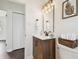 Elegant bathroom features a modern vanity, elegant mirror, and decorative lighting at 5934 51St N Ave, Kenneth City, FL 33709