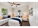 Cozy bedroom features a ceiling fan, dark wood floors, and built-in window seat at 5934 51St N Ave, Kenneth City, FL 33709