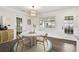 Inviting dining area with modern decor, hardwood flooring and an open bright space at 5934 51St N Ave, Kenneth City, FL 33709