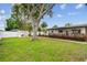 View of a well maintained lawn and landscape in front of this home at 5934 51St N Ave, Kenneth City, FL 33709