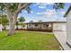 Well-manicured front yard and neutral painted home at 5934 51St N Ave, Kenneth City, FL 33709