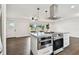 Kitchen featuring modern stainless steel appliances and a kitchen island with an oven range at 5934 51St N Ave, Kenneth City, FL 33709