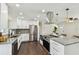 Bright modern kitchen featuring white cabinets, stainless steel appliances, and beautiful countertop with island at 5934 51St N Ave, Kenneth City, FL 33709