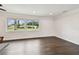 Bright living room with wooden floors and plenty of natural light from the windows at 5934 51St N Ave, Kenneth City, FL 33709