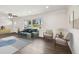 Bright living room with hardwood floors, comfortable seating, modern decor, and natural light at 5934 51St N Ave, Kenneth City, FL 33709