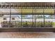 Screened-in patio with brown tile and view of the fenced backyard at 5934 51St N Ave, Kenneth City, FL 33709
