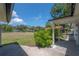 Expansive backyard with lush lawn, mature trees, and direct access to a serene waterfront at 6108 Oak Ridge Ave, New Port Richey, FL 34653