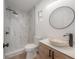 Modern bathroom featuring a glass enclosed shower and stone bowl sink at 6108 Oak Ridge Ave, New Port Richey, FL 34653