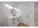 Modern bathroom featuring white vanity, sleek black fixtures, and stylish lighting at 6108 Oak Ridge Ave, New Port Richey, FL 34653