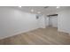 Bedroom boasts light wood-look flooring and recessed lighting at 6108 Oak Ridge Ave, New Port Richey, FL 34653