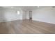Bedroom featuring light hardwood floors, one window, and a sliding-door closet at 6108 Oak Ridge Ave, New Port Richey, FL 34653