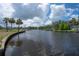 Scenic canal view with palm-lined banks and calm water, ideal for boating and waterfront living at 6108 Oak Ridge Ave, New Port Richey, FL 34653