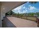 A spacious deck with wooden floors and railings offers stunning views of the surrounding river at 6108 Oak Ridge Ave, New Port Richey, FL 34653