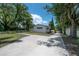 Wide driveway leading to a remodeled home with fresh exterior paint at 6108 Oak Ridge Ave, New Port Richey, FL 34653