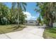 Well-maintained house with a large driveway and beautiful landscaping at 6108 Oak Ridge Ave, New Port Richey, FL 34653