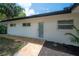 Newly remodeled home featuring a well-maintained exterior with inviting modern walkway at 6108 Oak Ridge Ave, New Port Richey, FL 34653
